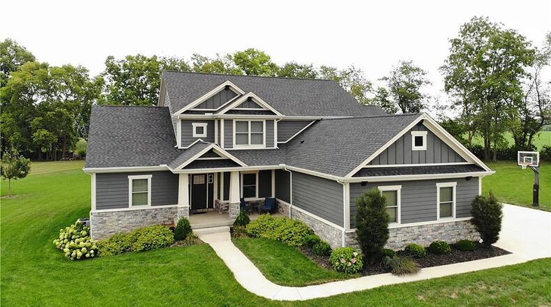 The custom two story home is in the Wood Ridge subdivision in Xenia.