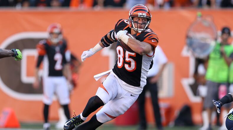 CINCINNATI, OH - OCTOBER 11: Tyler Eifert #85 of the Cincinnati Bengals runs after catching a pass during overtime against the Seattle Seahawks at Paul Brown Stadium on October 11, 2015 in Cincinnati, Ohio. Cincinnati defeated Seattle 27-24 in overtime. (Photo by Andy Lyons/Getty Images)