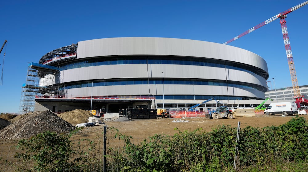 FILE - An outside view of the Santa Giulia Ice Hockey Arena, in Milan, where Ice Hockey discipline of the Milan Cortina 2026 Winter Olympics will take place Italy, Friday, Oct. 24, 2025. (AP Photo/Luca Bruno, File)