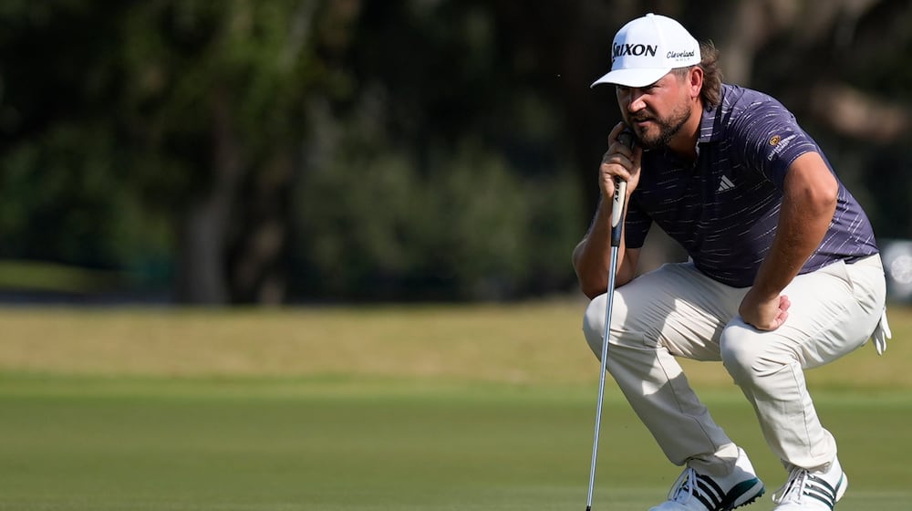 Andrew Novak lines up a putt on the nineth green during the second round of the RSM Classic golf tournament, Friday, Nov. 21, 2025, in St. Simons Island, Ga. (AP Photo/Mike Stewart)
