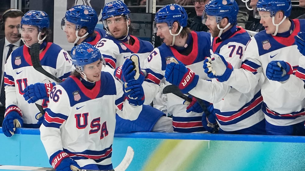 United States' Jack Hughes (86) celebrates after scoring his side's third goal during a men's ice hockey semifinal game between the United States and Slovakia at the 2026 Winter Olympics, in Milan, Italy, Friday, Feb. 20, 2026. (AP Photo/Hassan Ammar)