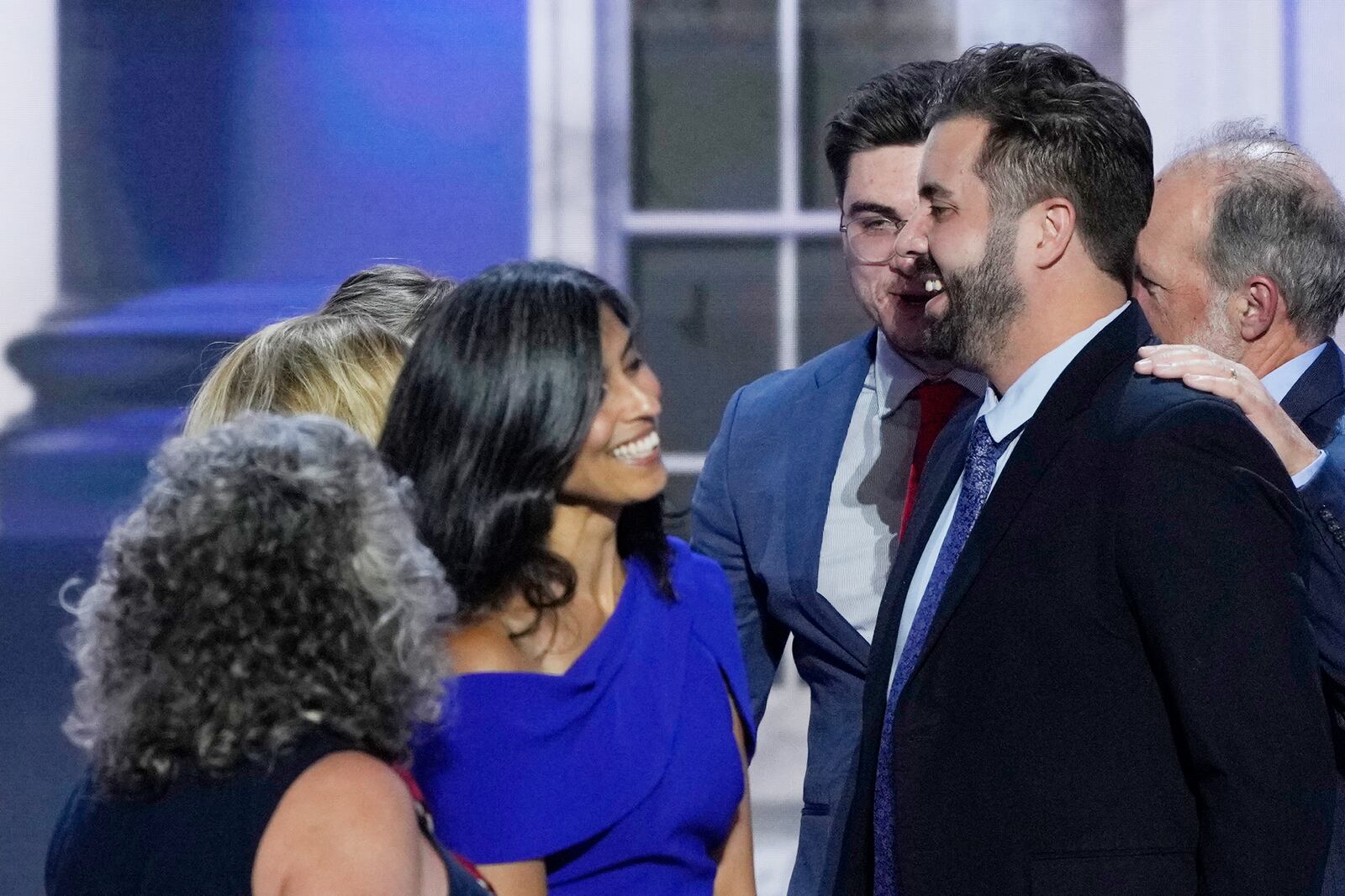 Cory Bowman, Vice President JD Vance's half-brother, from right, speaks with Usha Vance and others on stage during the Republican National Convention, Wednesday, July 17, 2024, in Milwaukee. (AP Photo/J. Scott Applewhite)