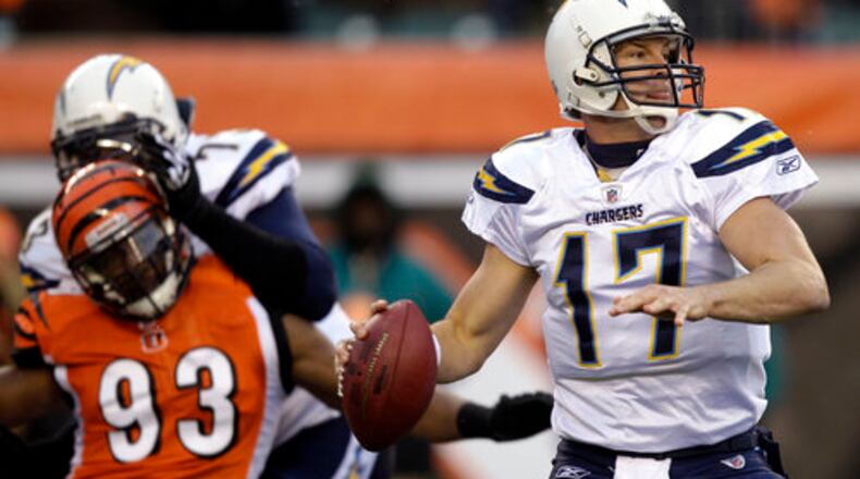 San Diego Chargers quarterback Philip Rivers (17) passes against the Cincinnati Bengals in the first half of an NFL football game, Sunday, Dec. 26, 2010, in Cincinnati. Chargers offensive tackle Marcus McNeill (73) blocks Cincinnati Bengals linebacker Michael Johnson (93).
