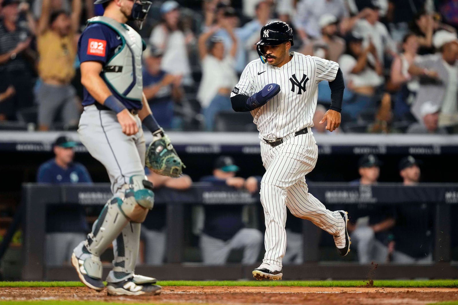 New York Yankees' Trent Grisham runs to home base during the ninth inning of a baseball game against the Seattle Mariners, Thursday, July 10, 2025, in New York. (AP Photo/Yuki Iwamura)