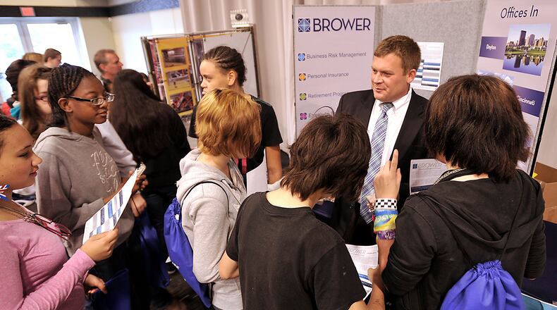 Otto Larson talks with a group of eight graders about a career in insurance during a career fair. About 1,000 eighth grade students from Clark County met with Clark County businesses at the Hollenbeck Bayley Conference Center. The annual program was one of the reasons Clark County was selected to participate in a national program. Bill Lackey/Staff