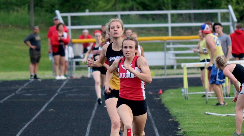 Tecumseh’s Kylee Mastin holds off Shawnee’s Grace Holmes to win the 800-meter title in the Central Buckeye Conference championships Friday. Greg Billing / Contributed