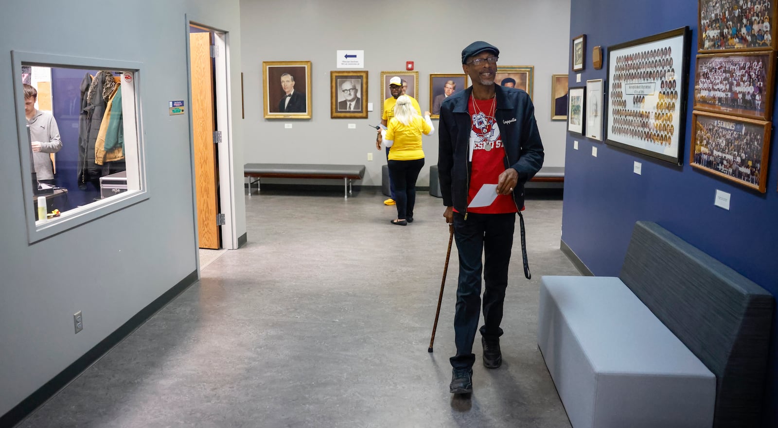Jeffrey Roberson, right, looks at photos of graduation classes from Springfield South High School as he walks in a hallway during a tour as part of "The Dome Experience" at the Dome on Wednesday, March 25, 2026, in Springfield. JOSEPH COOKE/STAFF