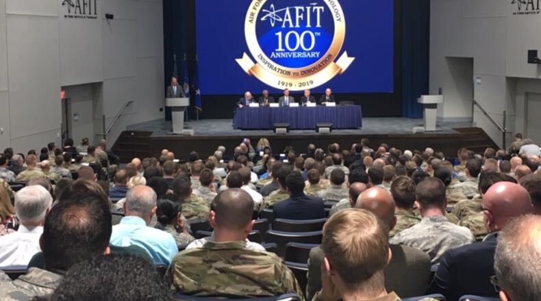 A standing-room-only audience hears a panel of five former astronauts with AFIT ties in the Kenny Hall Auditorium Thursday, in an event marking AFIT's 100th anniversary. The auditorium underwent a $4 million renovation recently. THOMAS GNAU/STAFF