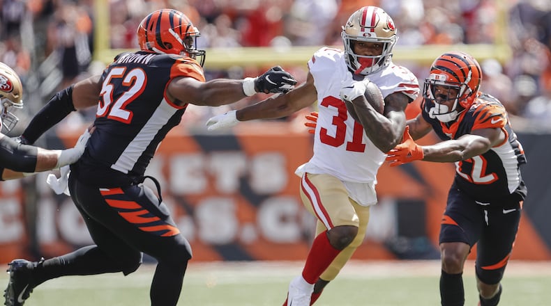 CINCINNATI, OH - SEPTEMBER 15: Raheem Mostert #31 of the San Francisco 49ers runs the ball for an eventual touchdown while Preston Brown #52 and William Jackson #22 of the Cincinnati Bengals pursueduring the first half at Paul Brown Stadium on September 15, 2019 in Cincinnati, Ohio. (Photo by Michael Hickey/Getty Images)