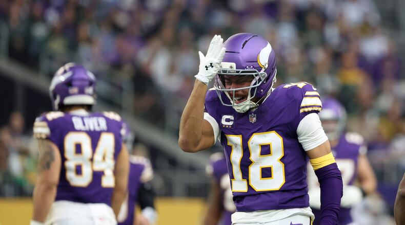 Minnesota Vikings wide receiver Justin Jefferson (18) reacts after catching a pass during the first half of an NFL football game against the Green Bay Packers, Sunday, Jan. 4, 2026, in Minneapolis. (AP Photo/Ellen Schmidt)