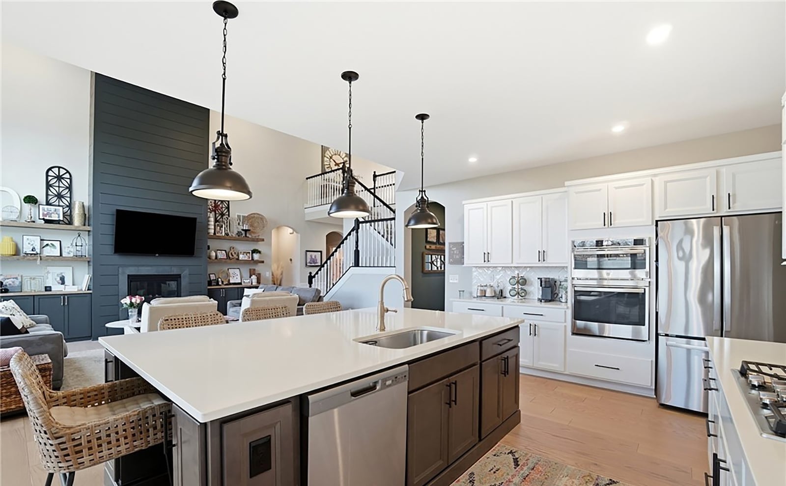 The gourmet style kitchen has quartz countertops, an island with bar seating and stainless appliances. CONTRIBUTED