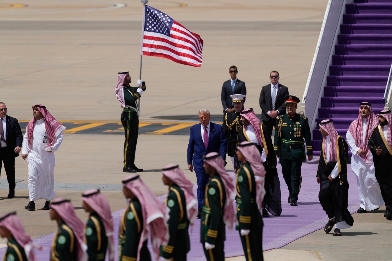 President Donald Trump speaks with Saudi Crown Prince Mohammed bin Salman during an arrival ceremony at the Royal Terminal of King Khalid International Airport in Riyadh, Saudi Arabia, Tuesday, May 13, 2025