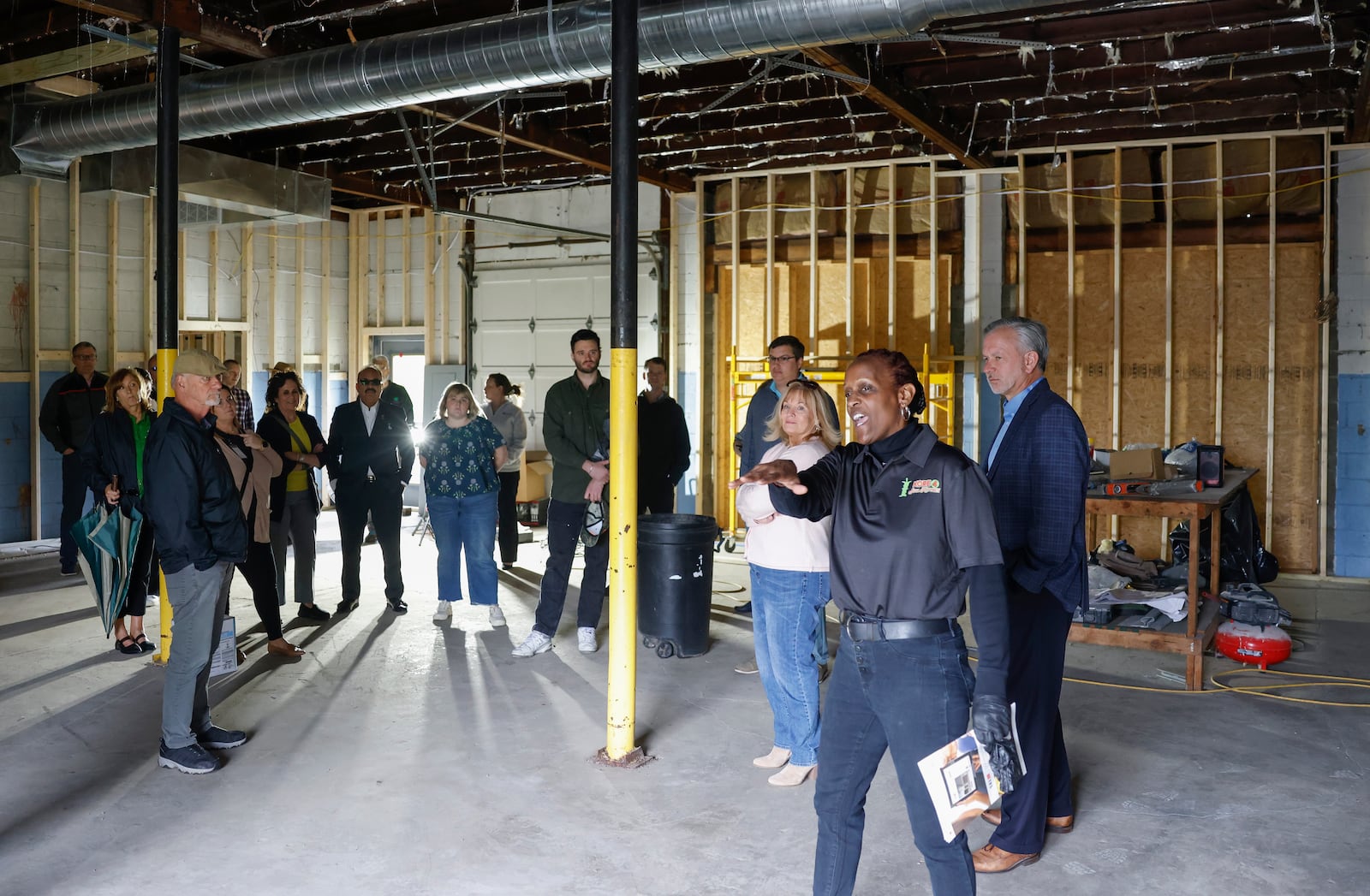 Nettie Carter-Smith, part-owner of Kore 4 Konnection, leads a tour on Tuesday, May 6, 2025, in a building that will be used for events at Kore 4 Konnection. JOSEPH COOKE/STAFF