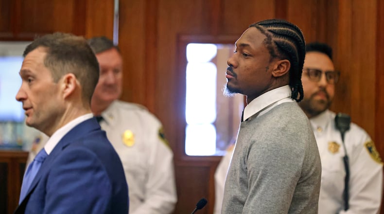 New England Patriots' Stefon Diggs, right, appears for his arraignment on felony strangulation and a misdemeanor assault charges, Friday, Feb. 13, 2026, at District Court in Dedham, Mass. (David L. Ryan/The Boston Globe via AP, Pool)