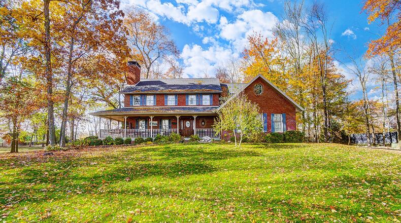 The front of the home has a full wraparound covered porch and a walkway connecting the driveway to the front door. CONTRIBUTED