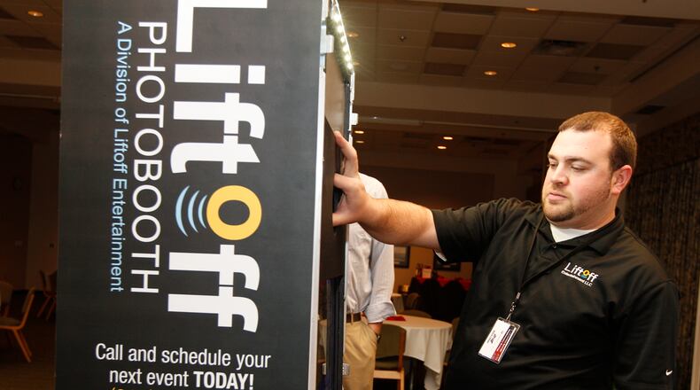 Jay Nigro, the owner of Liftoff Entertainment, a DJ and photo booth business, sets up his equipment before an event in the Wright State University Student Union on Friday, February 22, 2013. Barbara J. Perenic/Staff