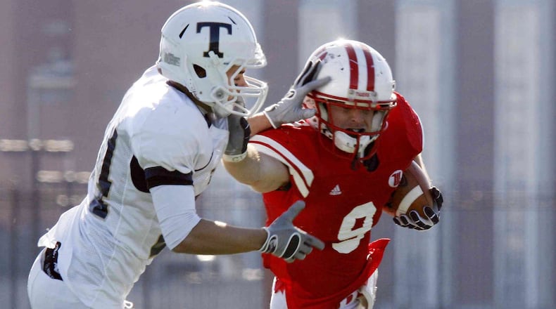 Corey Weber (9) of Wittenberg is pursued by Ryan Rickaby (24) of Trine during Saturday’s second-round Division III playoff football game at Edwards-Maurer Field on Nov. 28, 2009. Wittenberg won the game 34-17. Staff Photo by Barbara J. Perenic