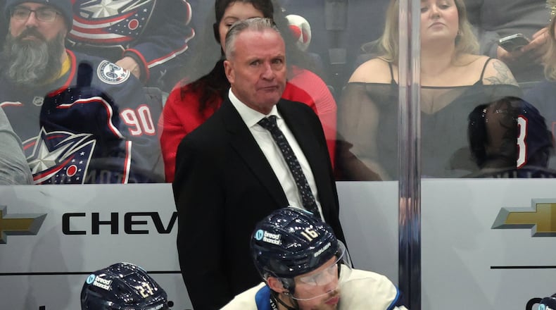 Columbus Blue Jackets coach Dean Evason watches his team during the third period of an NHL hockey game against the New Jersey Devils in Columbus, Ohio, Wednesday, Dec. 31, 2025. (AP Photo/Paul Vernon)