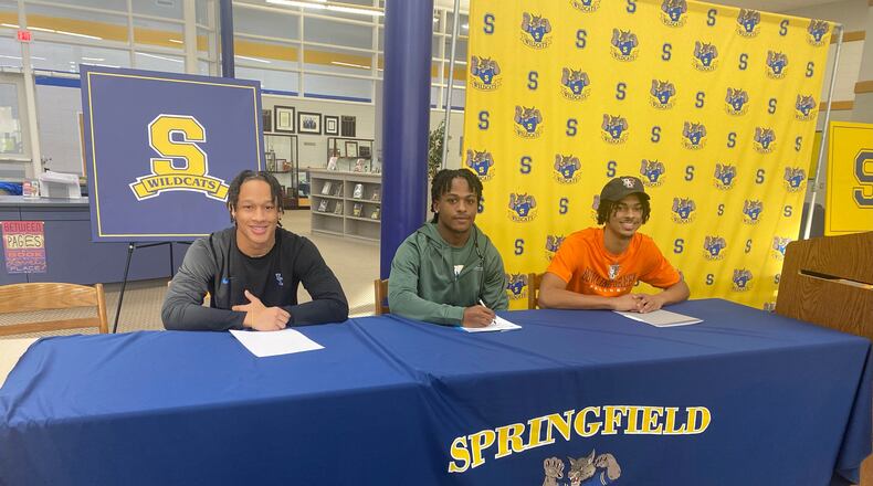 From left, Springfield senior football players Anthony Brown (Kentucky), Jaivian Norman (Eastern Michigan) and Shawn Thigpen (Bowling Green) signed letters of intent Wednesday on National Signing Day. CONTRIBUTED