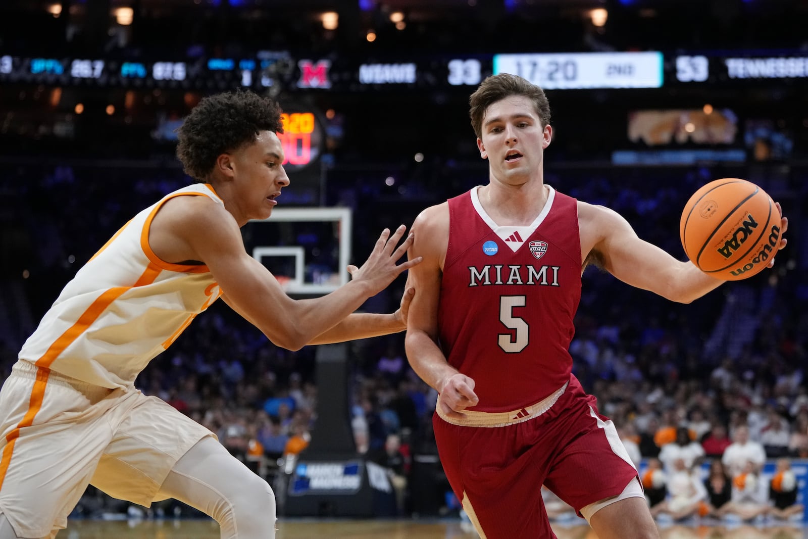 Miami (Ohio)'s Peter Suder, right, tries to get past Tennessee's Nate Ament during the second half in the first round of the NCAA college basketball tournament, Friday, March 20, 2026, in Philadelphia. (AP Photo/Matt Slocum)
