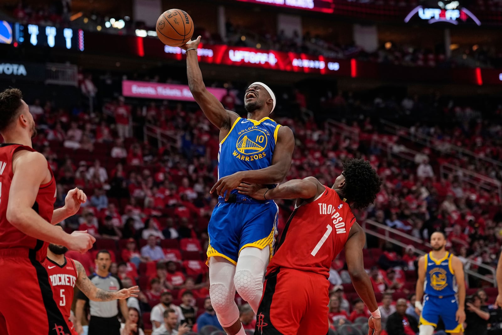 Golden State Warriors forward Jimmy Butler III (10) shoots over Houston Rockets forward Amen Thompson (1) during the second half of Game 5 of an NBA basketball first-round playoff series, Wednesday, April 30, 2025, in Houston. (AP Photo/David J. Phillip)