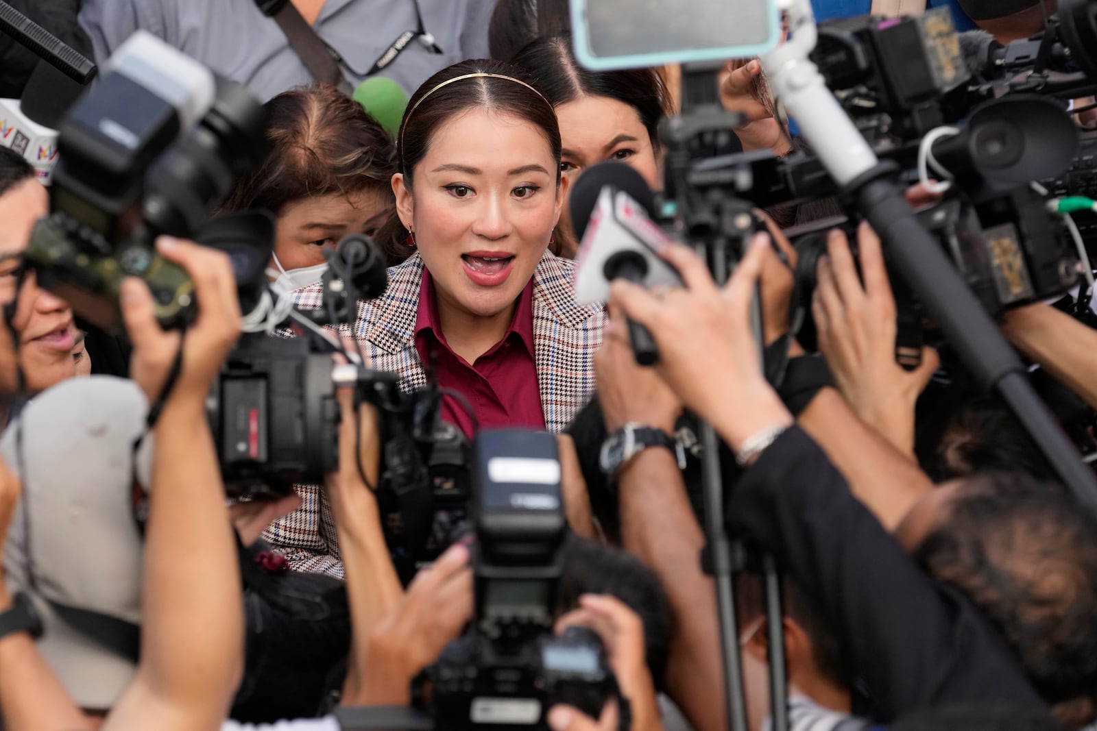 FILE - Paetongtarn Shinawatra, Pheu Thai party's top politician and youngest daughter of exiled former deposed Thai leader Thaksin Shinawatra, arrives for the registration of constituency candidates competing in upcoming general election, at the Thailand-Japan Youth Center stadium in Bangkok, Thailand, on April 3, 2023. (AP Photo/Sakchai Lalit, File)