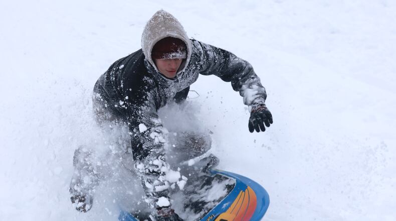 Students across western Ohio have had a chance to hit the sledding hills this January, as a large snowstorm hit just as most schools were set to return from winter break Monday, Jan. 6. BILL LACKEY/STAFF