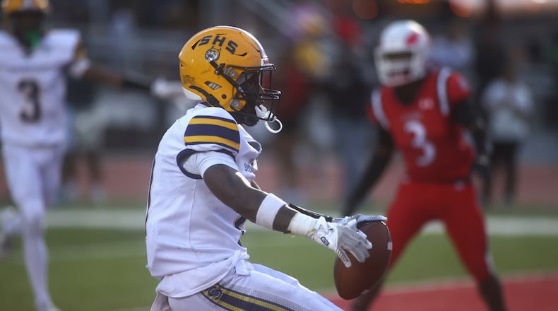 Springfield's Deontre Long celebrates a touchdown against Trotwood-Madison on Friday, Sept. 5, 2025, at Trotwood. David Jablonski/Staff