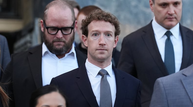 Meta CEO Mark Zuckerberg leaves after testifying in a landmark trial over whether social media platforms deliberately addict and harm children, Wednesday, Feb. 18, 2026, in Los Angeles. (AP Photo/Damian Dovarganes)