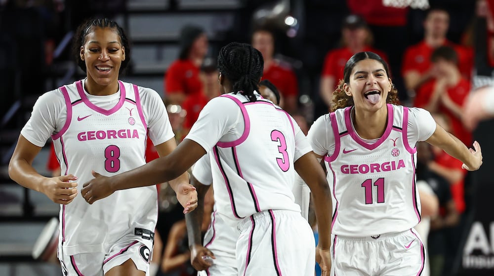 Georgia forward Zhen Craft (8) and guards Dani Carnegie (3) and Enjulina Gonzalez (11) react during the first half of an NCAA college basketball game against Vanderbilt, Sunday, Feb. 15, 2026, in Athens, Ga. (AP Photo/Colin Hubbard)