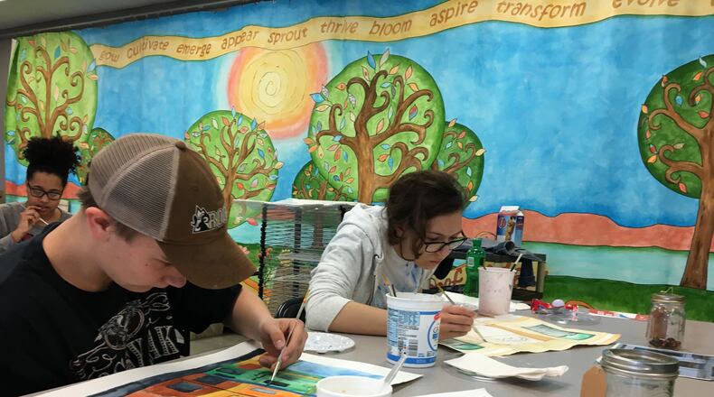 Springfield High student David Ritz, left, and Audree Speaks of Yellow Springs work on their watercolor paintings of West Main Street buildings for the upcoming Project Jericho’s Light on Main event. Photo by Brett Turner