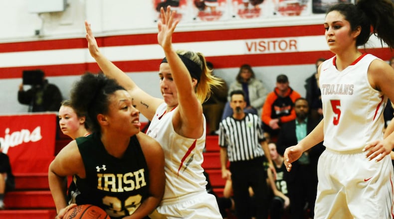 Abbigail Peterson of Catholic Central (with ball). FILE