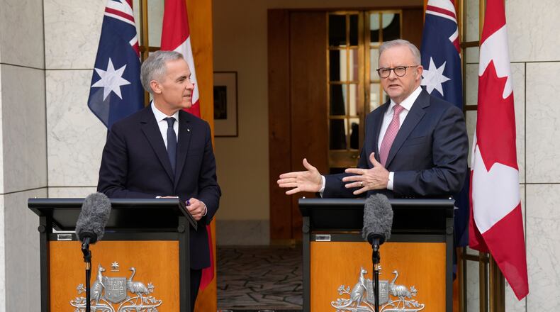 Canada's Prime Minister Mark Carney, left, and Australian Prime Minister Anthony Albanese participate in a joint news conference, in Canberra, Australia, Thursday, March 5, 2026. (Adrian Wyld/The Canadian Press via AP)