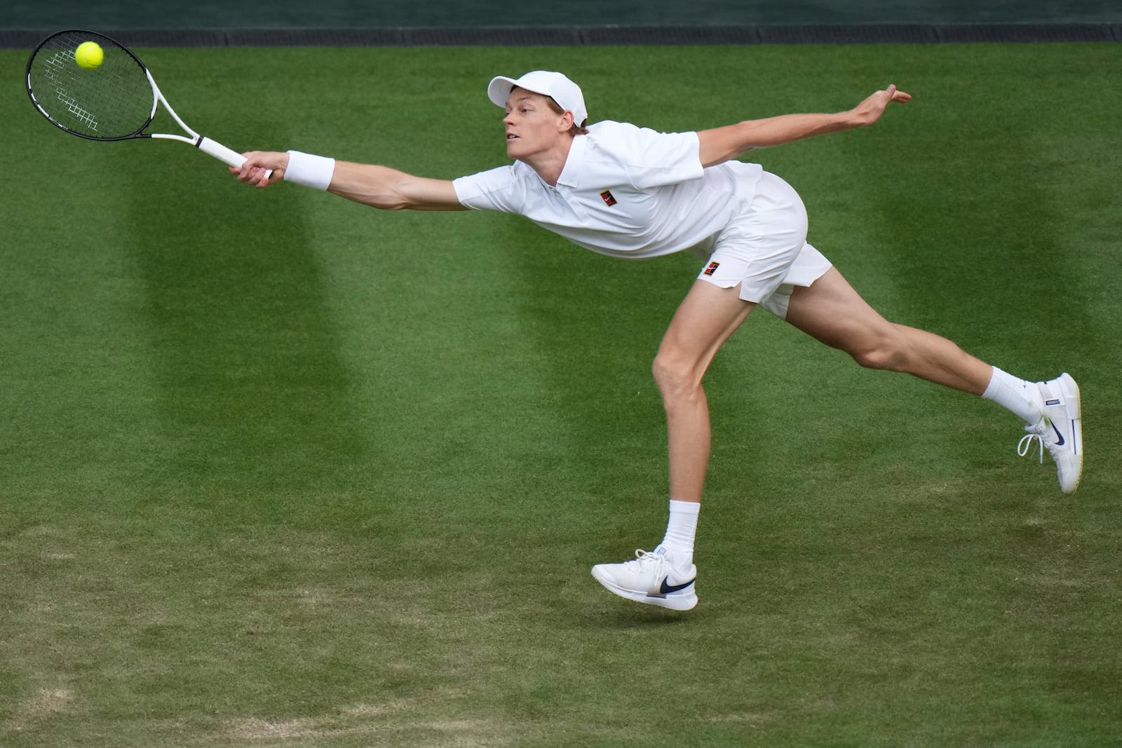 Jannik Sinner of Italy returns to Aleksandar Vukic of Australia during their second round men's singles match at the Wimbledon Tennis Championships in London, Thursday, July 3, 2025. (AP Photo/Alastair Grant)