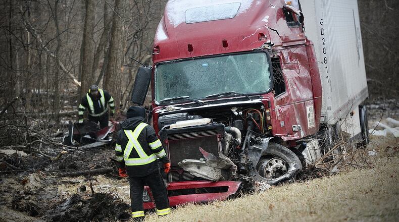 A tractor trailer slid off westbound 70 near the 66 mile marker in Clark County sliding into a tree line Thursday, February 3, 2022 causing heavy damage there were no injuries. MARSHALL GORBY/STAFF