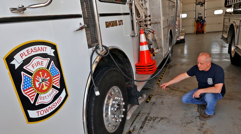 Pleasant Township Fire Chief Mike Willis points out a leak on the department's 36-year-old fire engine Wednesday, April 12, 2023. BILL LACKEY/STAFF