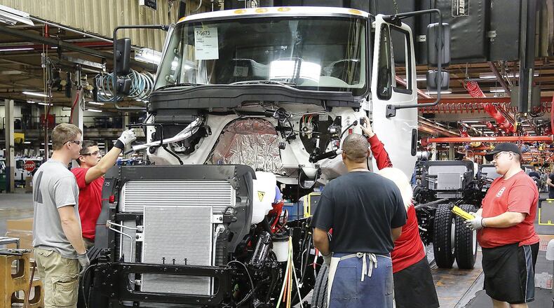 Workers at Navistar's Springfield plant assemble a truck cab in 2017. Bill Lackey/Staff