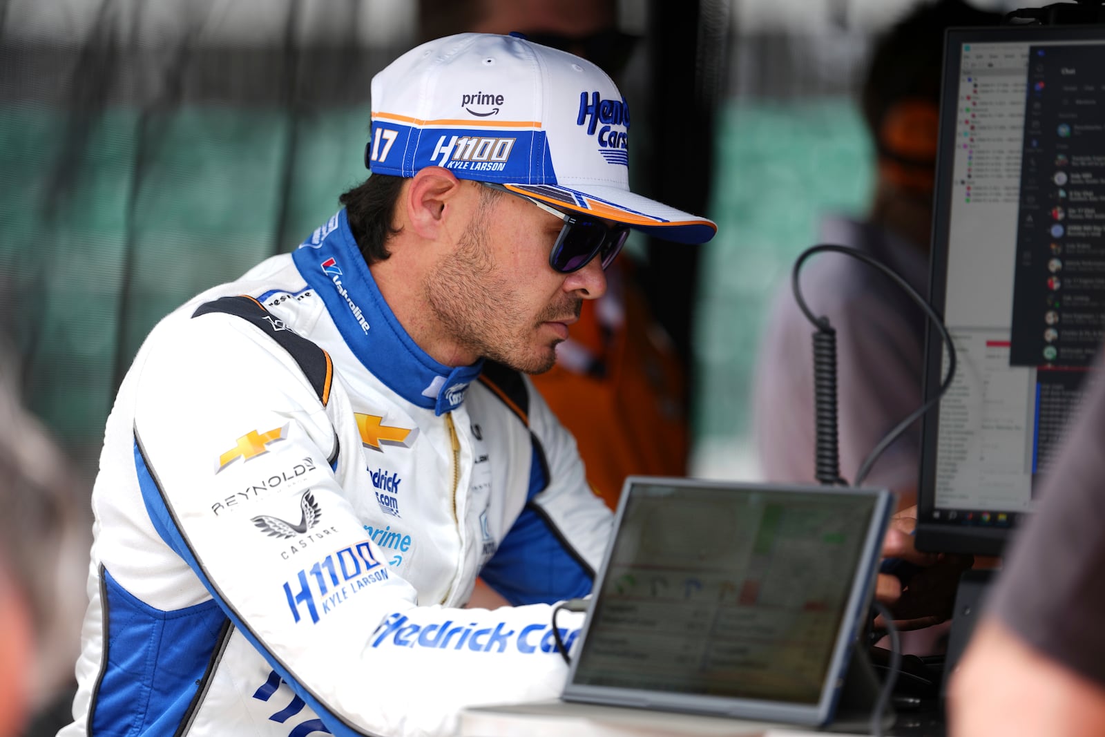 Kyle Larson looks over data after driving during practice for the Indianapolis 500 auto race at Indianapolis Motor Speedway in Indianapolis, Wednesday, May 14, 2025. (AP Photo/Michael Conroy)