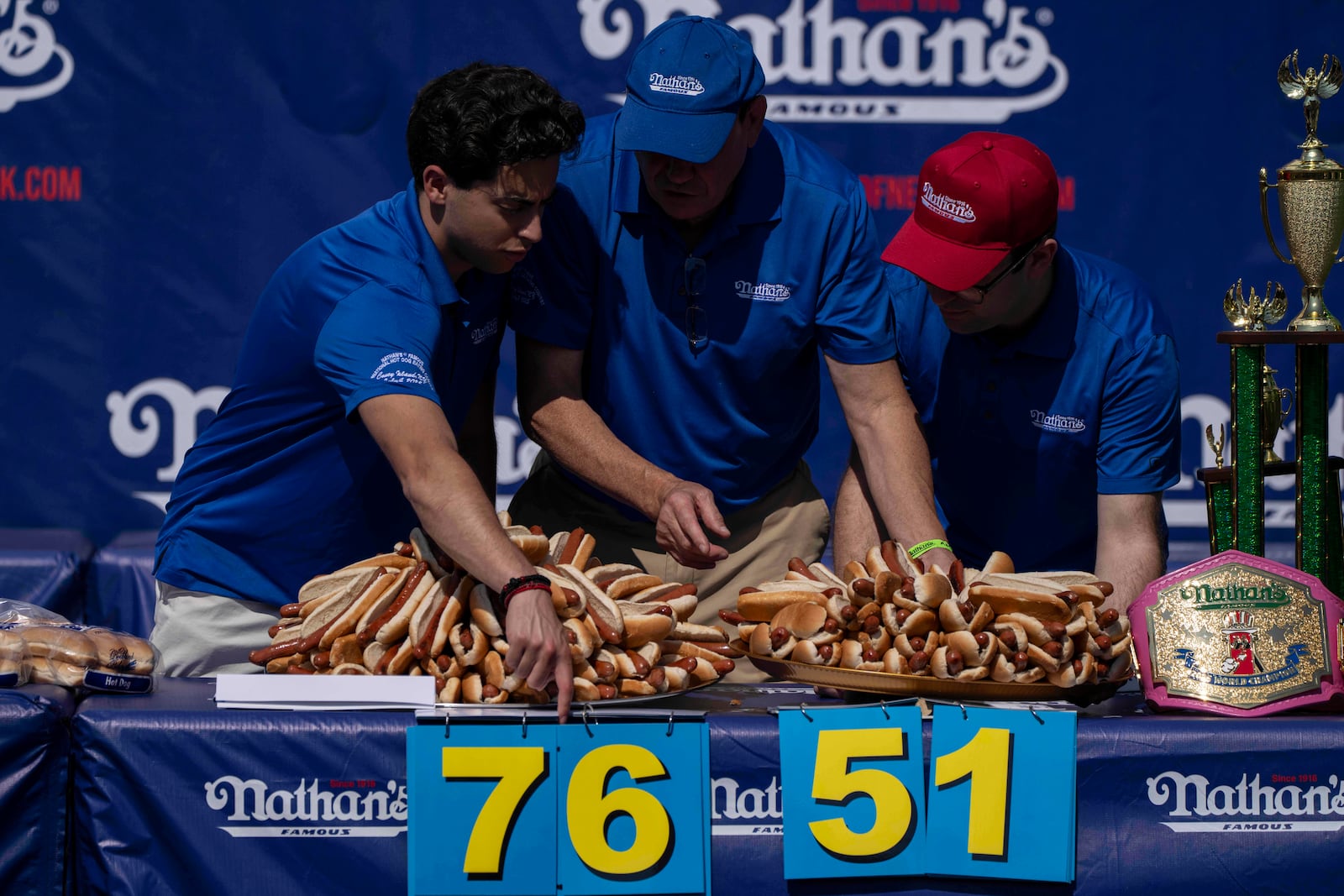 People prepare hot dogs ahead of the 2025 Nathan's Famous Fourth of July hot dog eating contest in the Coney Island section of the Brooklyn borough of New York, Thursday, July 4, 2025. (AP Photo/Yuki Iwamura)