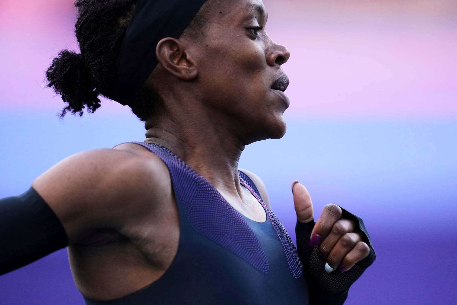 Faith Kipyegon, from Kenya, runs in an attempt to become the first woman to run a mile in under four minutes, at Stade Charlety in Paris, Thursday, June 26, 2025. (AP Photo/Christophe Ena)