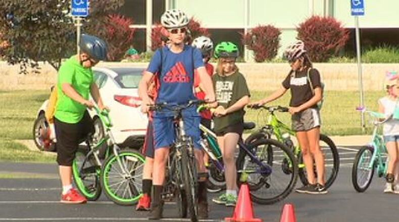 Participants, ages 6 - 13 years old, learn how to properly ride their bikes as park of the Springfield Police Division Bike Camp. JEFF GUERINI/STAFF