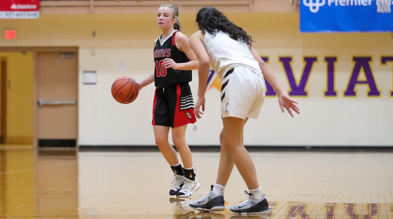 Cutline: Tecumseh High School's Mae Mastin is guarded by Centerville's Amy Velasco during their game last season at the Vandalia Butler Student Activities Center. Mastin is averaging 15.3 points per game this season for the Arrows. CONTRIBUTED PHOTO BY MICHAEL COOPER