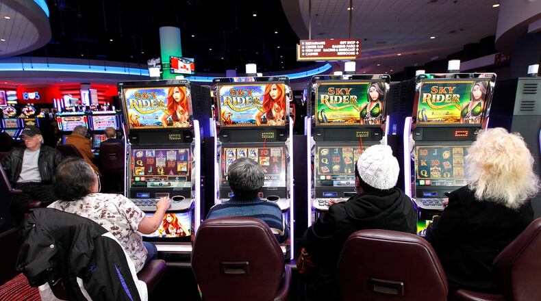 Guests play gaming machines Thursday at Miami Valley Casino in TurtlecreekTwp.