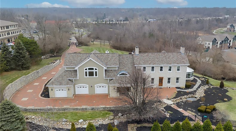 This historical limestone farmhouse sits on a hill overlooking two acres. Originally built in 1815, it has a 2002 addition that includes a new primary bedroom suite, a four car garage and main level living areas, including an updated professional style kitchen. CONTRIBUTED.