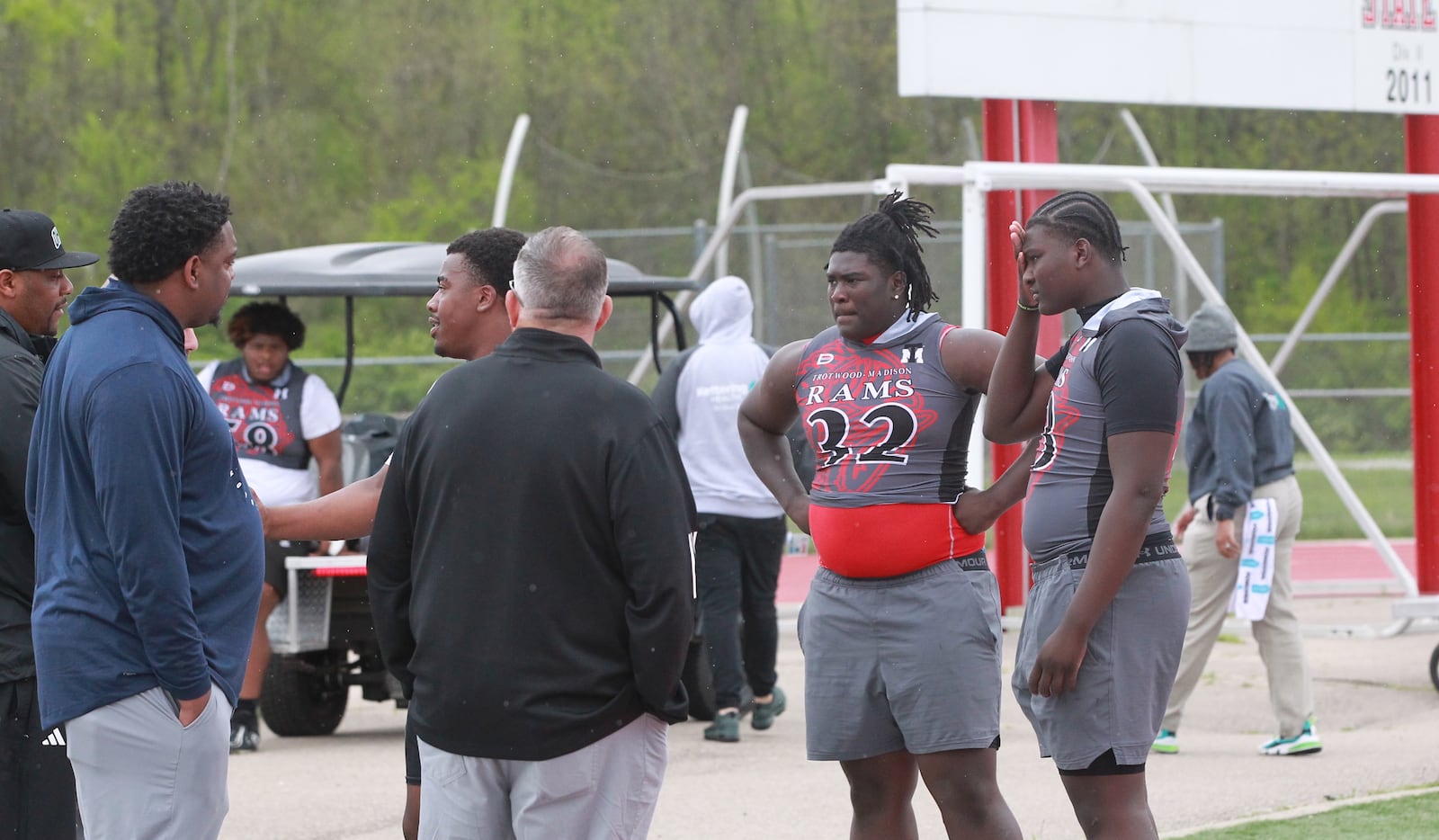 Trotwood defensive linemen speak to college coaches during the Miami Valley high school football recruiting showcase