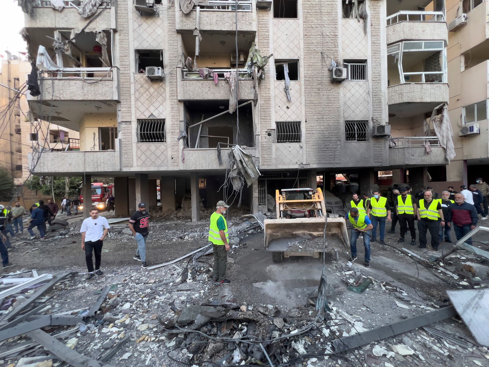 Rescue workers remove debris at the site of an Israeli airstrike in Dahiyeh, the southern suburb of Beirut, Lebanon, Sunday, April 27, 2025. (AP Photo/Hussein Malla)