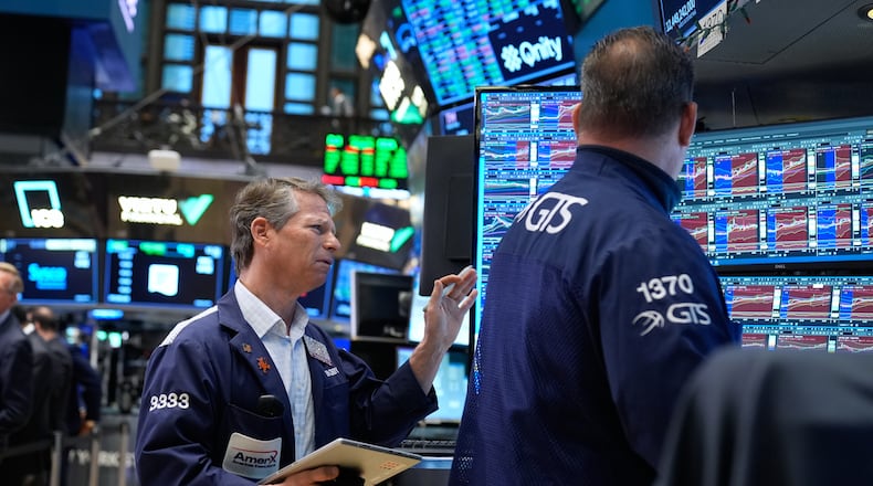 Bobby Charmak works on the floor at the New York Stock Exchange in New York, Monday, March 30, 2026. (AP Photo/Seth Wenig)