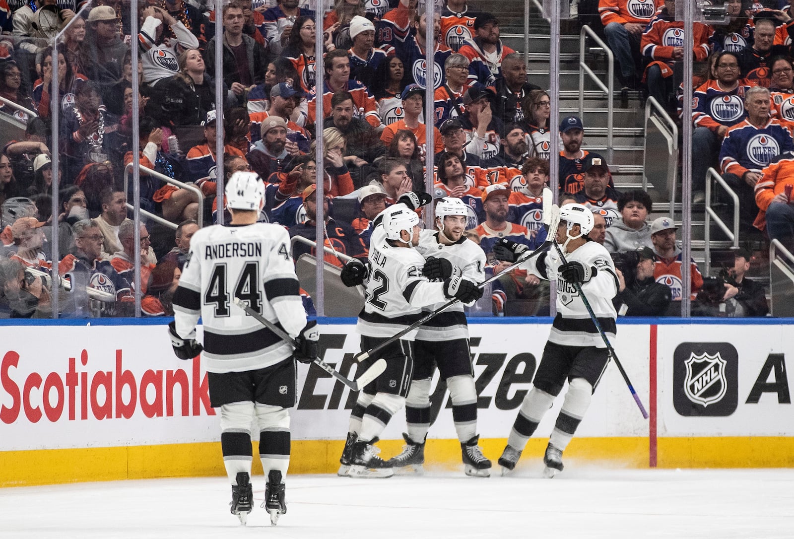 Los Angeles Kings' Mikey Anderson (44), Kevin Fiala (22), Alex Laferriere (14) and Quinton Byfield (55) celebrate a goal against the Edmonton Oilers during the second period of an NHL playoff game in Edmonton on Sunday, April 27, 2025. (Jason Franson/The Canadian Press via AP)