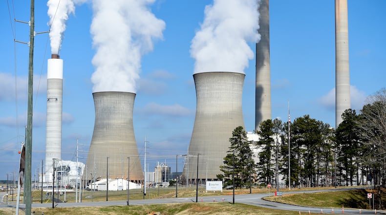 FILE - Georgia Power Co.'s Plant Bowen generates electricity, Dec. 14, 2020, in Euharlee, Ga. (AP Photo/Mike Stewart, File)