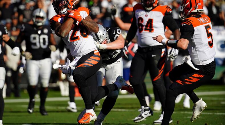 OAKLAND, CALIFORNIA - NOVEMBER 17: Joe Mixon #28 of the Cincinnati Bengals rushes for a touchdown during the first half against the Oakland Raiders at RingCentral Coliseum on November 17, 2019 in Oakland, California. (Photo by Daniel Shirey/Getty Images)